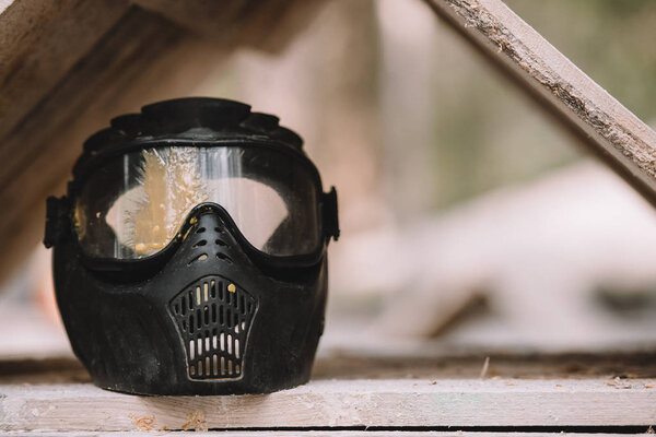 close up view of goggle mask covered by paintball splash outdoors 