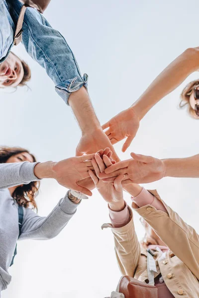 Bottom View Young Friends Putting Hands Together — Stock Photo, Image