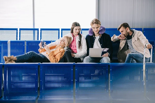 Friends Using Laptop While Waiting Flight Airport Terminal — Stock Photo, Image