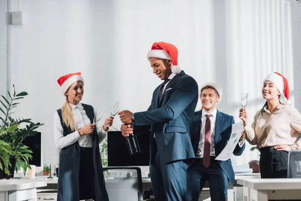 Happy African American Businessman Santa Hat Opening Bottle Wine While — Stock Photo, Image