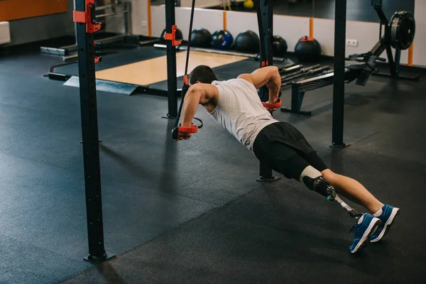 Handsome Young Sportsman Artificial Leg Doing Push Ups Hanging Rings — Stock Photo, Image