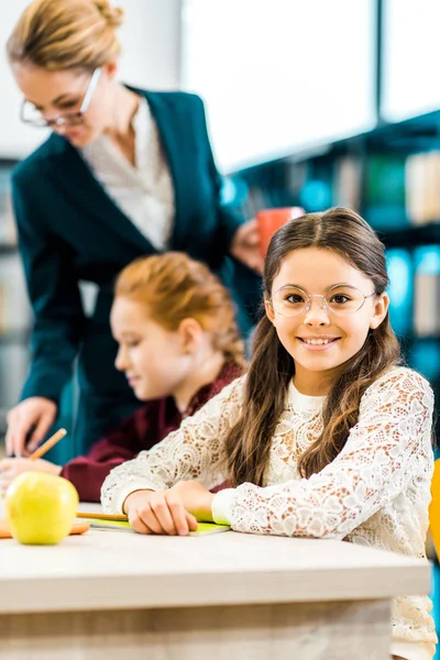 Cute Schoolkid Eyeglasses Smiling Camera While Studying Classmate Teacher Library — Stock Photo, Image
