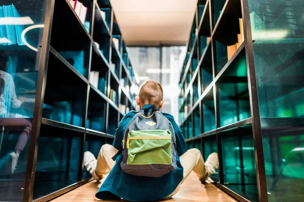 Back View Boy Backpack Sitting Floor Library — Stock Photo, Image