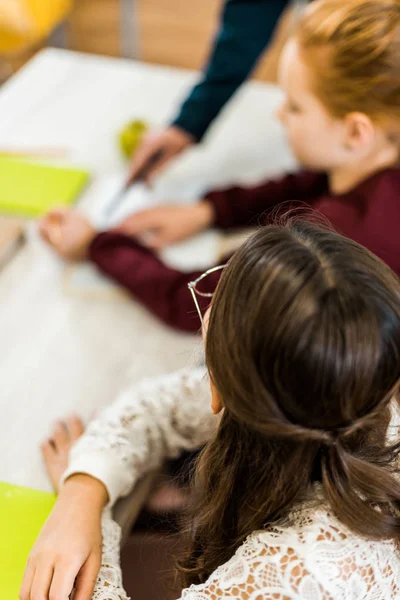 High Angle View Schoolgirls Studying Together Desk Royalty Free Stock Images