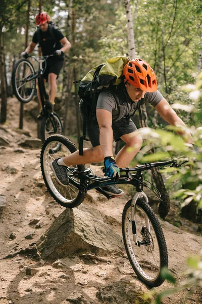 Young trial bikers  outdoors — Stock Photo