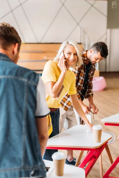 Happy young students spending time together at lecture room of university — Stock Photo