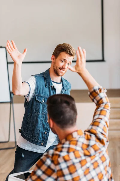 Successful young students giving high five at college — Stock Photo