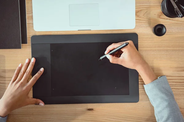Cropped shot of designer drawing on graphics tablet at workplace — Stock Photo