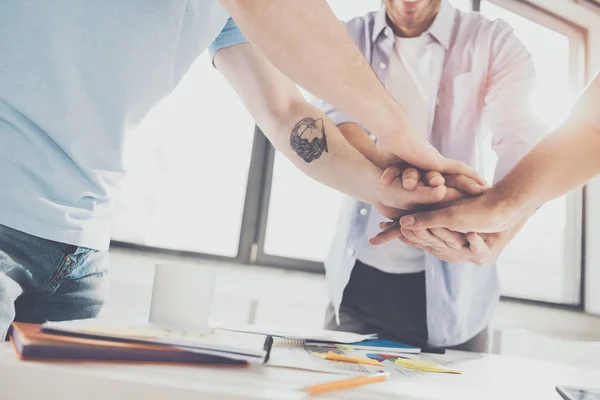 Close-up partial view of businessmen stacking hands while working on project together, business teamwork concept — Stock Photo