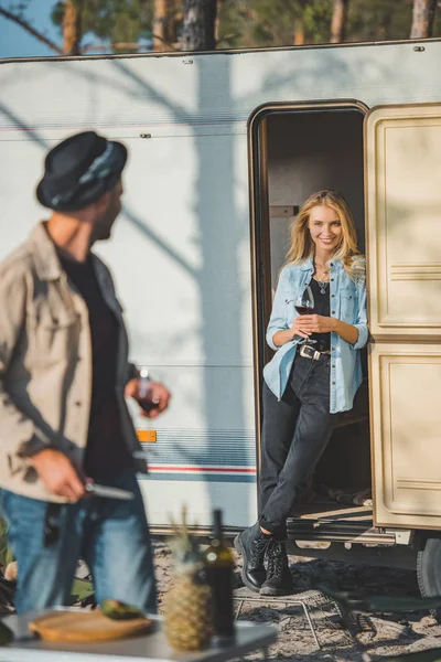 Selective focus of girl with glass of wine looking at boyfriend — Stock Photo