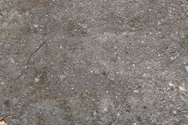 Çatlamak çimento arka plan, siyah asfalt yol yüzeyi hasarlı.