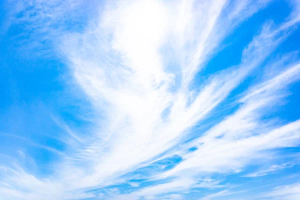 Light blue sky with streak white cloud.