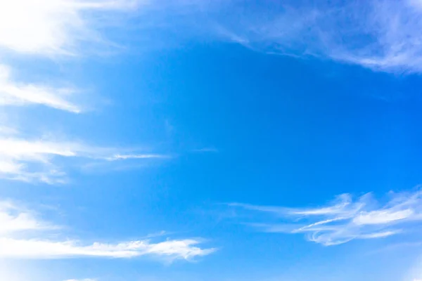 Light blue sky with streak white cloud.