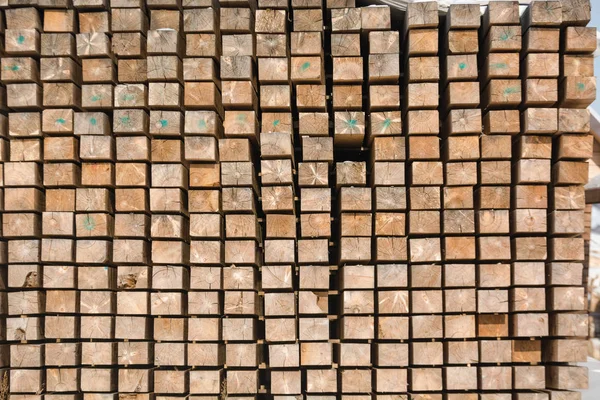 Wooden boards in a stack. Pine boards. A lot of lumber. Warehouse wooden boards.