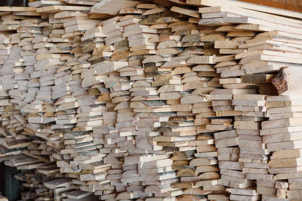 Timber at work. Lumber stockpiled. The boards are stacked. Boards for sale in stock. Lumber.