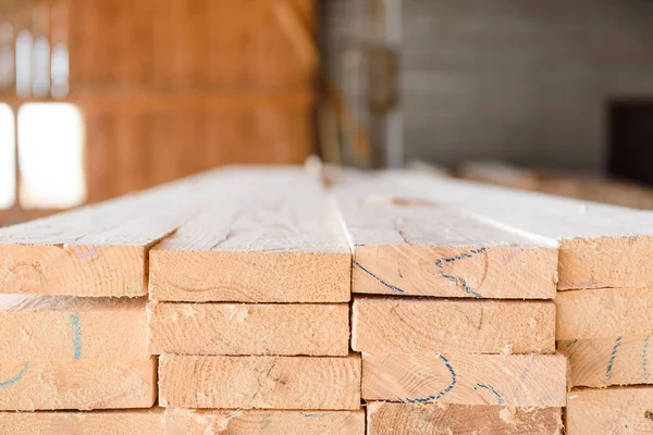 Timber at work. Lumber stockpiled. The boards are stacked. Boards for sale in stock. Lumber.