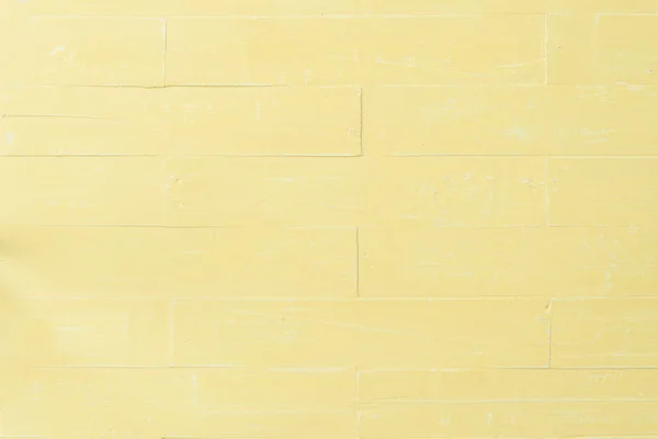 パステル調の明るい黄色の木製テーブル背景テクスチャ — ストック写真