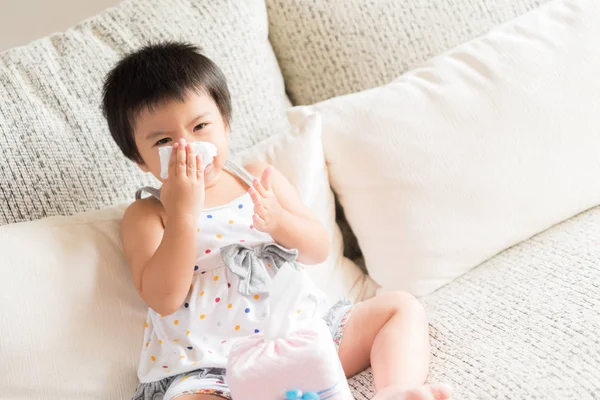 Sick Little Asian Girl Wiping Cleaning Nose Tissue Sitting Sofa — Stock Photo, Image