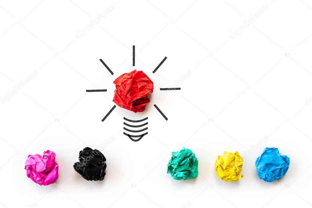 Inspiration and great idea concept. light bulb with crumpled colorful paper on white background.