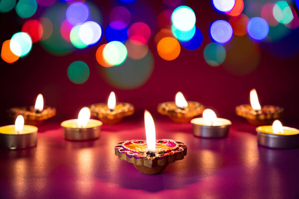 Happy Diwali - Clay Diya lamps lit during Dipavali, Hindu festival of lights celebration