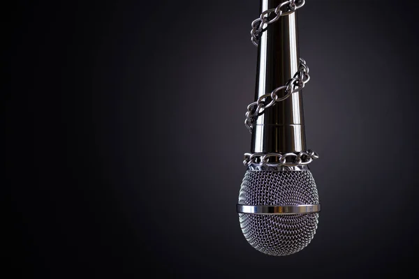 Microphone with a chain, depicting the idea of freedom