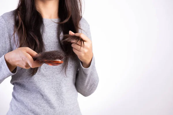 Healthy concept. Woman show her brush with damaged long loss hair and looking at her hair. — Stock Photo, Image