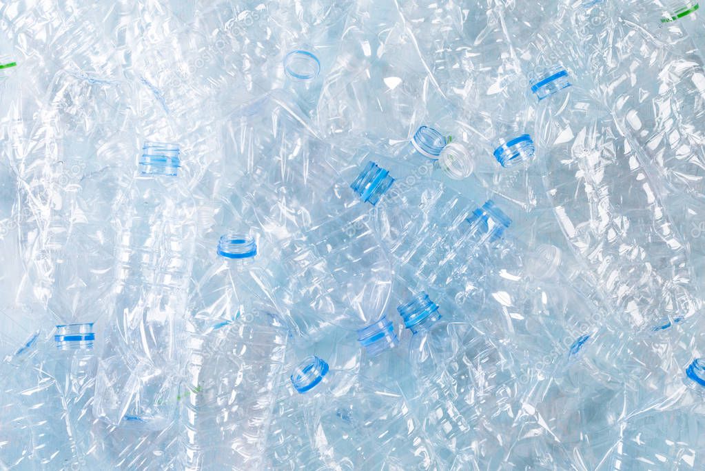 Top view of blue plastic bottles background. Recycle concept