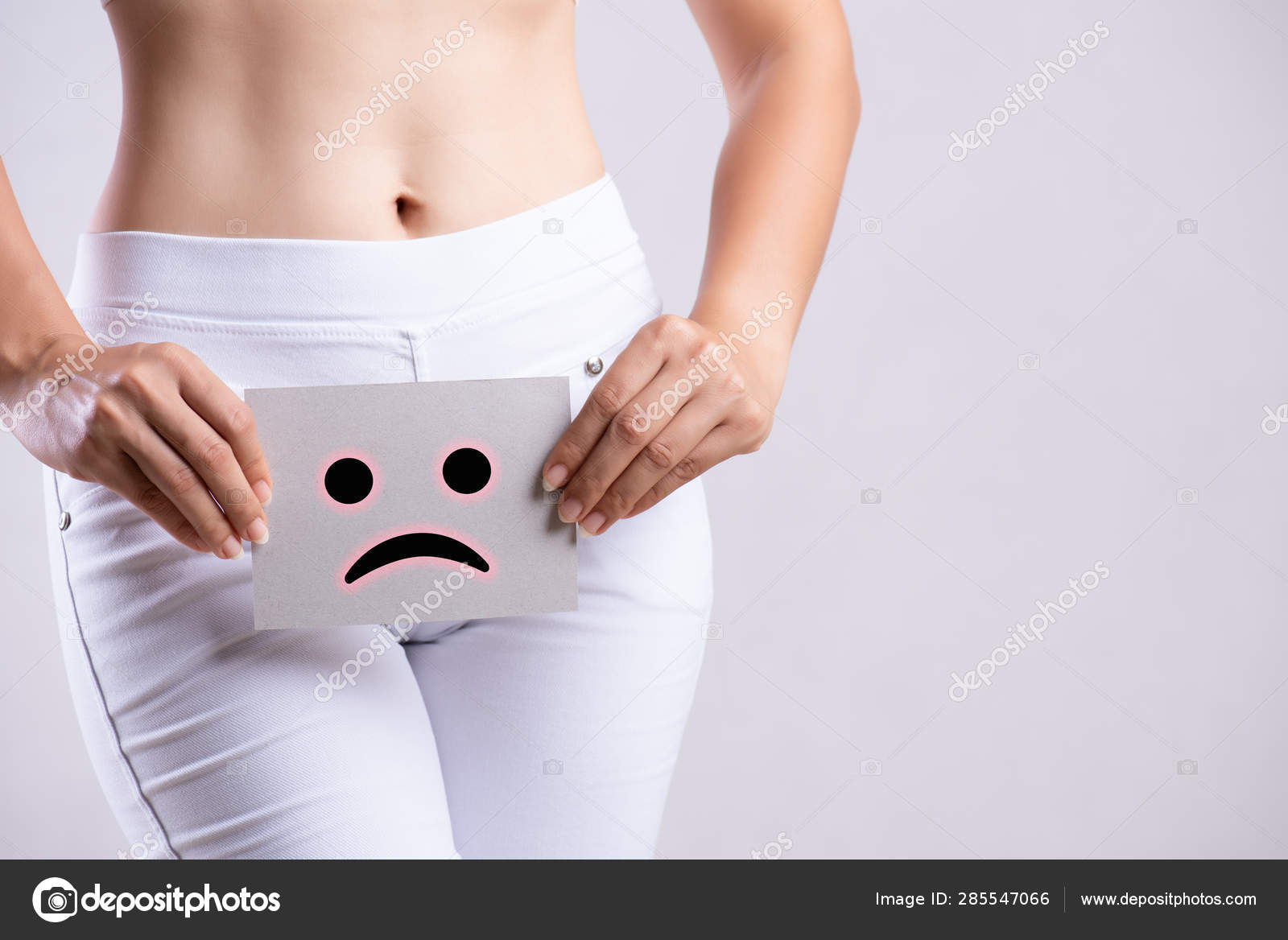Download A Woman Holding A Sad Face On Her Face