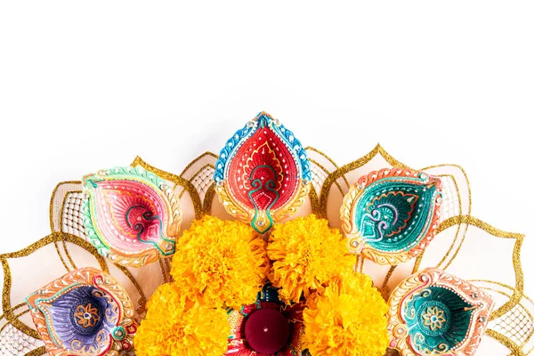 Happy Diwali - Clay Diya lamps lit during Dipavali, Hindu festival of lights celebration. Colorful traditional oil lamp diya on white background — Stock Photo, Image