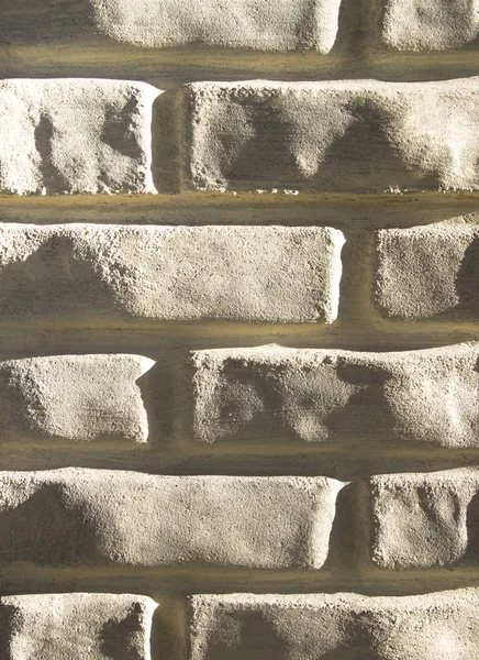 background texture light brick wall close-up brick sliding light vertical