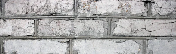 Старая имитация кирпичной стены из бетона с трещинами — стоковое фото