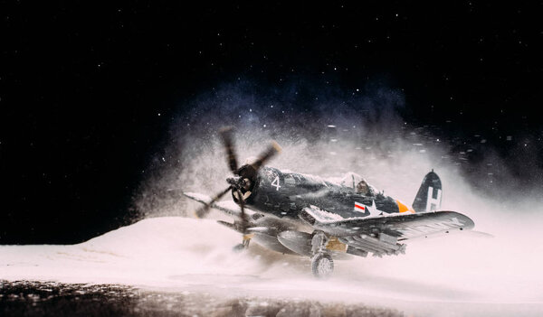 World war II military aircraft with heavy snowfall 