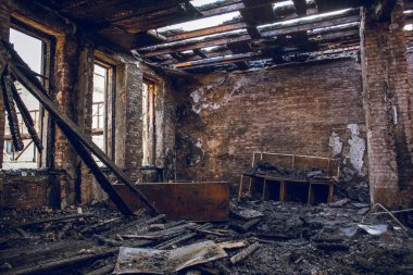 Burned house interior after fire, ruined building room inside, disaster or war aftermath clipart
