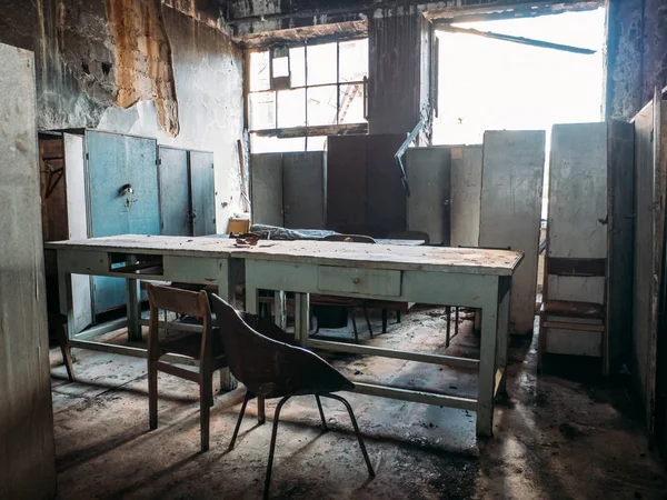 Abandoned ruined house with furniture after war or disaster, old building inside interior
