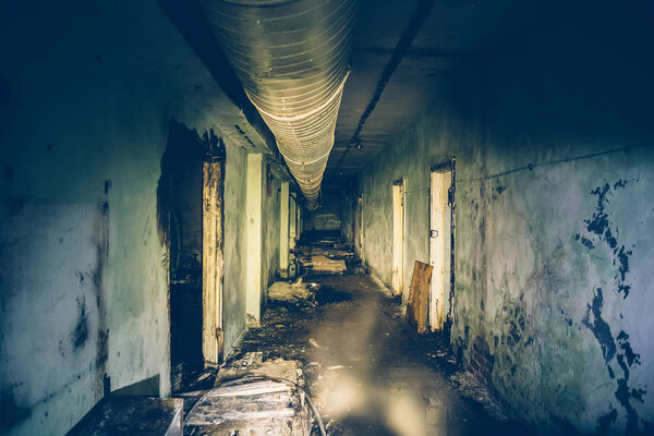 Dark flooded corridor or tunnel in old underground abandoned Soviet military bunker