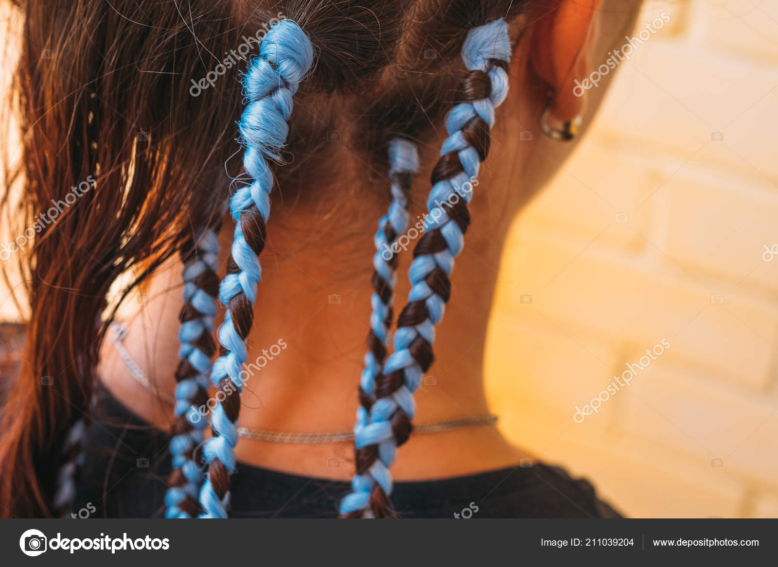 Hairdresser Weaves Braids With Kanekalon Material To Young Girl