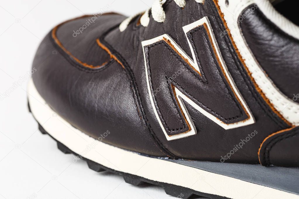 Moscow, Russia - Circa August 2018 : New Balance Shoes logo - letter N on new leather sneakers. New Balance - American manufacturer of sportswear founded in 1906