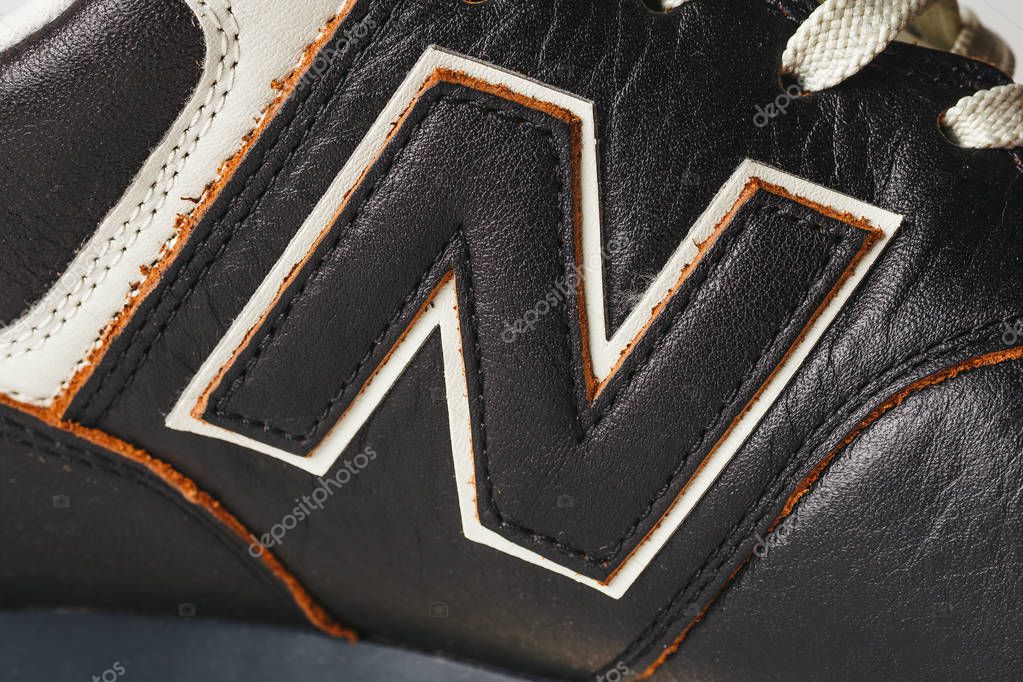 Moscow, Russia - Circa August 2018 : New Balance Shoes logo - letter N on new leather sneakers. New Balance - American manufacturer of sportswear founded in 1906