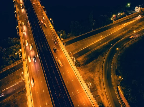 Top view from drone to city roads or highways with moving cars in the night — Stock Photo, Image