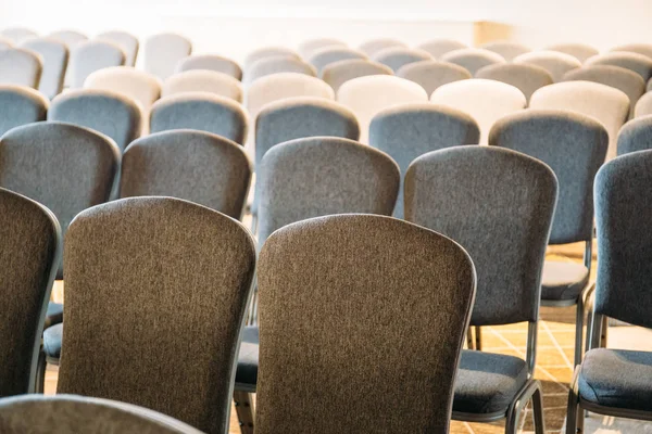 Rows of chairs in event auditorium room or class
