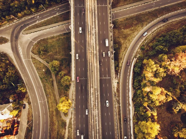 Aerial or top view from drone to road junction, freeway and bridge and car traffic in big city, urban transportation concept — Stock Photo, Image