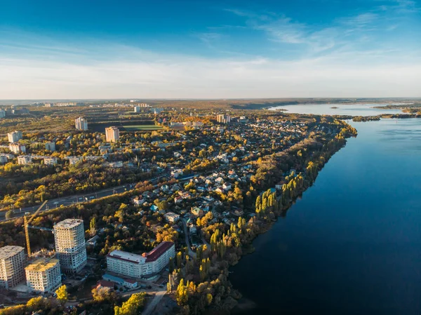 Aerial view panorama of Voronezh city from above at sunset, many buildings, roads and big blue river in summer evening — Stock Photo, Image