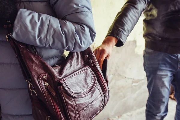 Thief steals phone or smartphone from bag of  woman close up, pickpocket in city — Stock Photo, Image