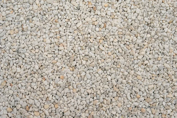 Pequenas rochas brancas ou pedras textura superficial, material mineral de cascalho industrial, fundo para design como pano de fundo — Fotografia de Stock