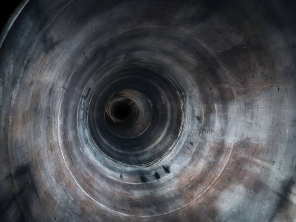Abstract round grunge tube or pipe inside view with perspective and motion effect, empty sewer tunnel with dark in end
