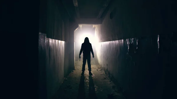 Silhouette of man in dark creepy and spooky corridor — Stock Photo, Image