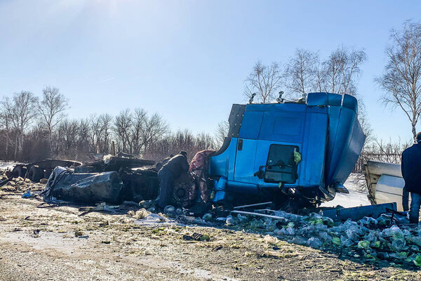 Crashed and damaged freight cargo truck after road accident