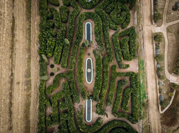 Green garden maze, aerial top view from drone. Landscape design