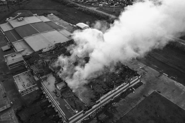 Demolished burning industrial building