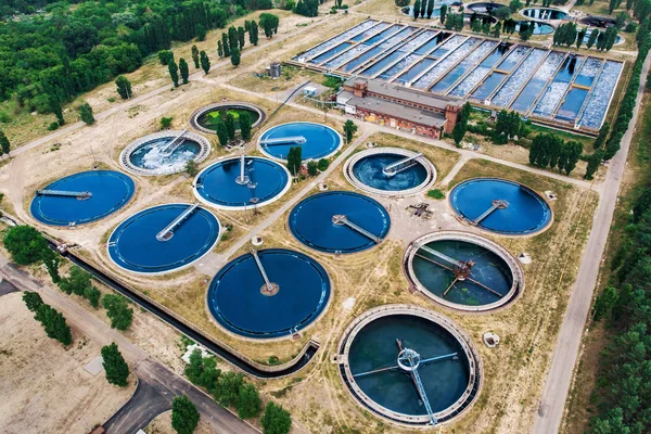 Modern wastewater treatment plant with round ponds for recycle dirty sewage water, aerial view